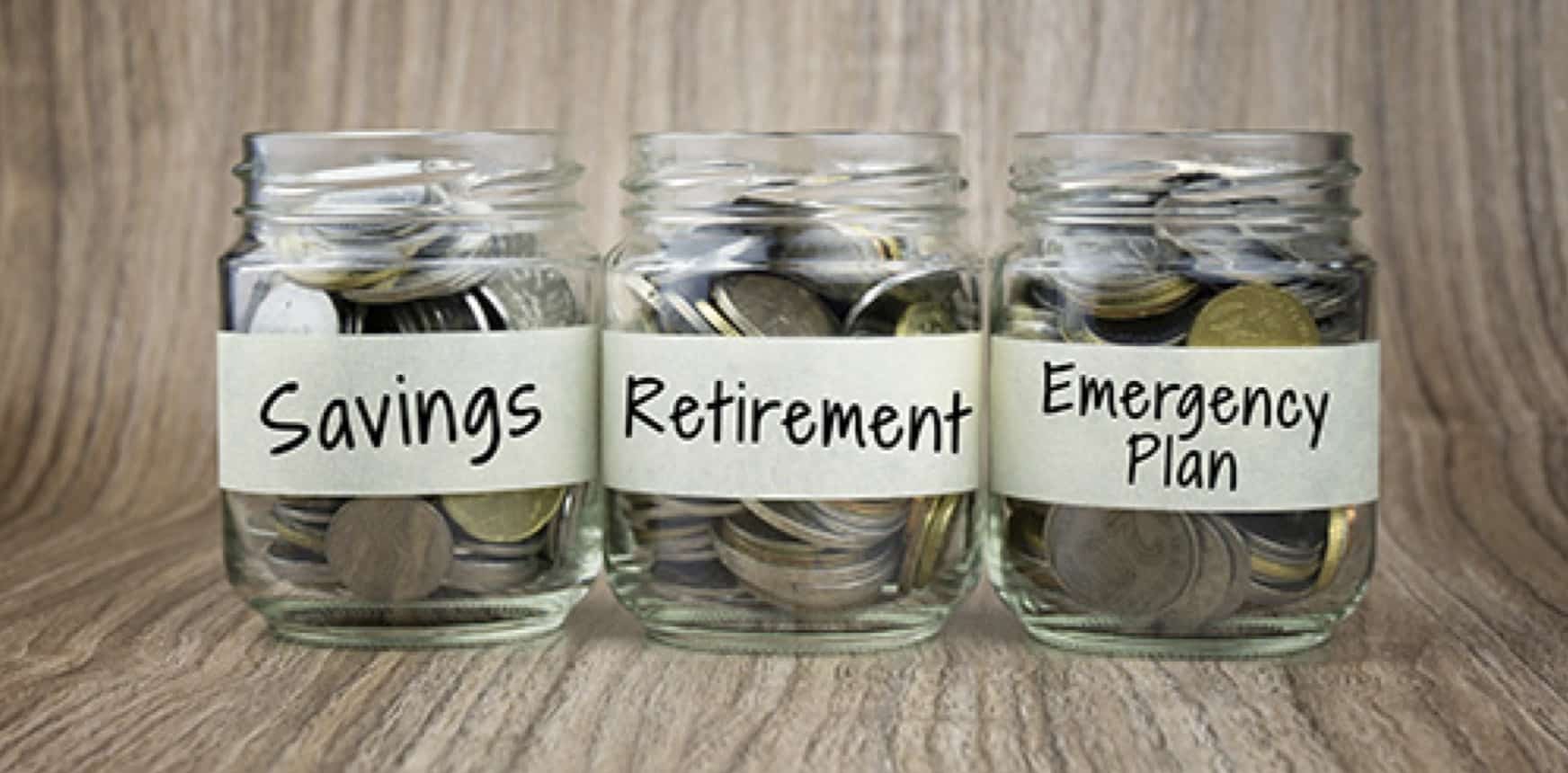 three jars of coins labels savings, retirement, emergency plan, for budgeting