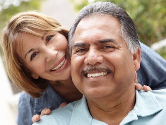 older latino couple smiling